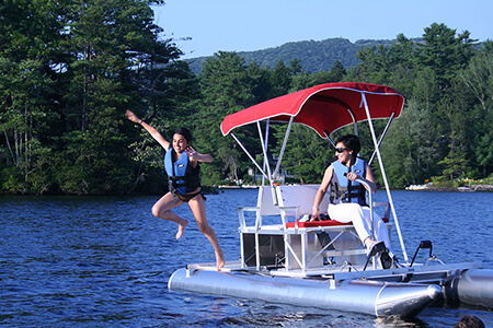 Aqua Cycle II paddle pedal boat with red bimini top