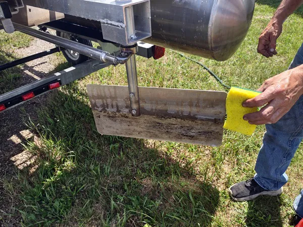 Apply cleaner onto small area, here is the rudder.